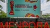 Seorang pria berjalan melewati poster turnamen sepak bola Piala Dunia FIFA U-20 Indonesia 2023 di Jakarta, 30 Maret 2023. FIFA mencoret Indonesia sebagai tuan rumah Piala Dunia U-20 tahun ini di tengah gejolak politik atas partisipasi Israel. (BAY ISMOYO / AFP)