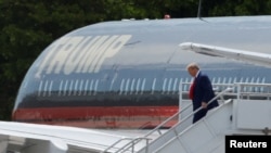 Former U.S. President Donald Trump arrives at Miami International Airport in Miami, Florida, June 12, 2023. 