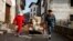Masked villagers drag a bed during carnival celebrations in Ituren, northern Spain, Jan. 29, 2024. 