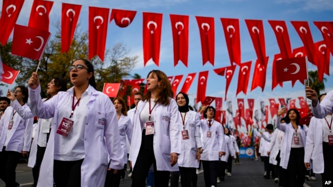 Medical students take part in a parade during celebrations marking the 100th anniversary of the creation of the modern secular Turkish Republic, in Istanbul, Turkey, Oct. 29, 2023.