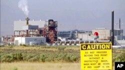 FILE - In this photo provided by the US Army, steam from the pollution abatement system rises from a smokestack at the Army's disposal plant as a rocket is destroyed at the nation's first chemical weapons incinerator Aug. 22, 1996, in Tooele, Utah.