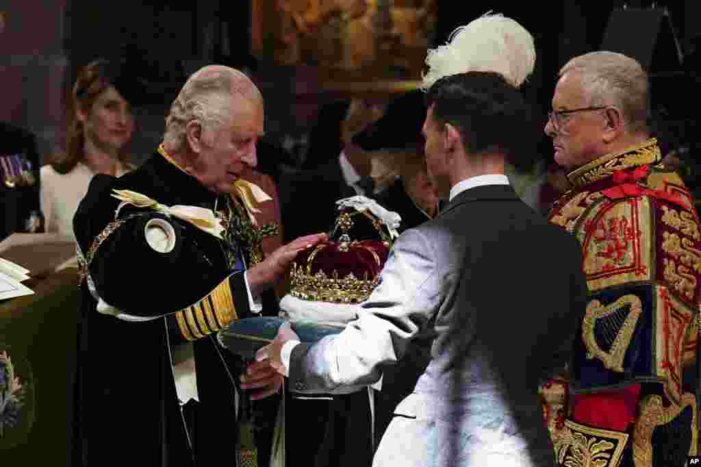 Britain&#39;s King Charles III is presented with the Crown of Scotland during the National Service of Thanksgiving and Dedication for King Charles III and Queen Camilla, and the presentation of the Honours of Scotland, at St Giles&#39; Cathedral, in Edinburgh.