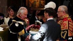 Britain&#39;s King Charles III is presented with the Crown of Scotland during the National Service of Thanksgiving and Dedication for King Charles III and Queen Camilla, and the presentation of the Honours of Scotland, at St Giles&#39; Cathedral, in Edinburgh.