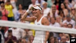 FILE -Czech Republic's Marketa Vondrousova reacts after beating Ukraine's Elina Svitolina to win their women's singles semifinal match on day 11 of Wimbledon, London, July 13, 2023. 