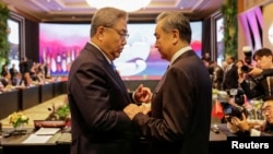South Korea's Foreign Minister Park Jin, left, talks to China's Communist Party's foreign policy chief Wang Yi prior to the Association of Southeast Asian Nations (ASEAN) Plus Three Foreign Ministers' Meeting in Jakarta, Indonesia, July 13, 2023. 