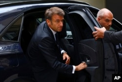 French President Emmanuel Macron arrives to attend a government emergency meeting after riots erupted for the third night in a row across the country, in Paris, June 30, 2023.