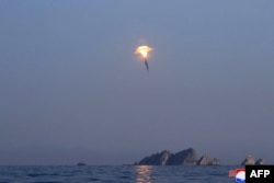 This picture taken on March 27, 2023 and released by North Korea's official Korean Central News Agency (KCNA) on March 28, 2023 shows a missile during a demonstration firing drill at an undisclosed location in North Korea.