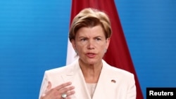 Latvian Foreign Minister Baiba Braze speaks to reporters in Berlin, July 1, 2024. Braze told VOA in an interview on the eve of the NATO summit in Washington that "it's time to lift all the restrictions on the military aid that we provide" to Ukraine.