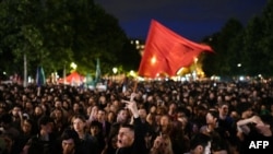 Demonstrators take part in a rally against far-right after the announcement of the results of the first round of parliamentary elections, at Place de la Republique in Paris, June 30, 2024.
