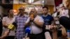 "The Bull," Tsang Kin-shing, center, founder of Hong Kong's pro-democracy Citizens' Radio station, along with station guests, speaks to reporters prior to the station's last broadcast in Hong Kong, June 30, 2023.