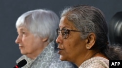 India's Finance Minister Nirmala Sitharaman (R) speaks next to US Treasury Secretary Janet Yellen during a joint statement with U.S., at the Mahatma Mandir in Gandhinagar on July 17, 2023.