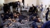FILE - Foreign prisoners, suspected of being part of the Islamic State group, lie in a prison cell in Hasaka, Syria, Jan. 7, 2020.
