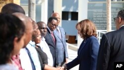 U.S. Vice President Kamala Harris greets survivors of the 1998 bombing of the American Embassy in Tanzania at National Museum and House of Culture in Dar es Salaam, Tanzania, March 30, 2023.