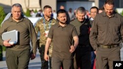 Ukraine's President, Volodymyr Zelenskyy, center, leaves after holding a press conference at the European Political Community (EPC) Summit in Bulboaca, near Chisinau, Moldova, June 1, 2023.