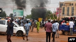 Supporters of the Nigerien defense and security forces attack the headquarters of the Nigerien Party for Democracy and Socialism (PNDS), the party of overthrown President Mohamed Bazoum, in Niamey on July 27, 2023. 
