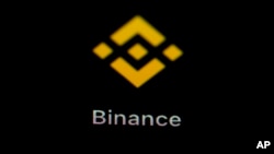 FILE - The Binance app icon is seen on a smartphone, Feb. 28, 2023, in Marple Township, Pa. 