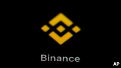 FILE — The Binance app icon is seen on a smartphone in Marple Township, Pa., Feb. 28, 2023.
