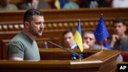 FILE - In this photo provided by the Ukrainian Presidential Press Office, Ukrainian President Volodymyr Zelenskyy addresses lawmakers of the Ukrainian parliament, in Kyiv, June 28, 2023. 