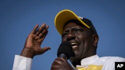 FILE - Kenyan presidential candidate William Ruto addresses supporters at his final electoral campaign rally at Nyayo stadium in Nairobi, Kenya on Saturday, August 6, 2022. 