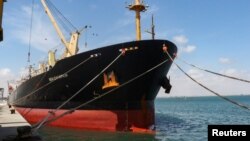 The Greek-flagged bulk cargo vessel Sea Champion is docked at the port of Aden, Yemen, where it arrived after being attacked in the Red Sea in what appeared to have been a mistaken missile strike by Houthi militia, Feb. 21, 2024.