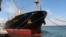 The Greek-flagged bulk cargo vessel Sea Champion is docked at the port of Aden, Yemen, where it arrived after being attacked in the Red Sea in what appeared to have been a mistaken missile strike by Houthi militia, Feb. 21, 2024.