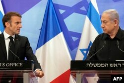 Israeli Prime Minister Benjamin Netanyahu and French President Emmanuel Macron hold a joint press conference in Jerusalem on Oct. 24, 2023.