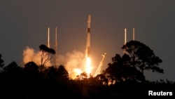 FILE - A SpaceX Falcon 9 rocket lifts off with a payload of 21 Starlink internet satellites from the Cape Canaveral Space Force Station in Cape Canaveral, Fla., Feb. 27, 2023.