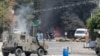 Palestinians run during clashes with Israeli forces amid an Israeli military operation in Jenin, in the Israeli-occupied West Bank, July 3, 2023.