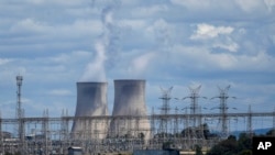 FILE- Bayswater Power Station, a coal-powered thermal power station, operates near Muswellbrook in the Hunter Valley, Australia, Nov. 2, 2021. 