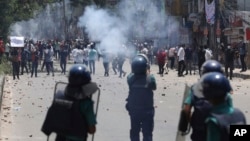 Students clash with riot police during a protest against a quota system for government jobs, in Dhaka, Bangladesh, July 18, 2024.