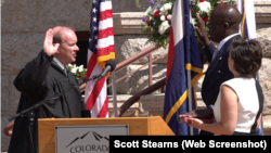 In this screen grab from video, Nigerian immigrant Yemi Mobolade is sworn in on June 6, 2023, as mayor of Colorado Springs in the U.S. state of Colorado.