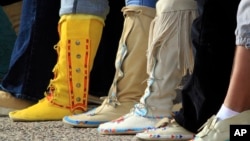 Participants put their feet down during the "Rock Your Mocs" celebration at the Indian Pueblo Cultural Center in Albuquerque, New Mexico, on Nov. 15, 2013. Today, Native American women are putting their feet down and demanding equal pay.