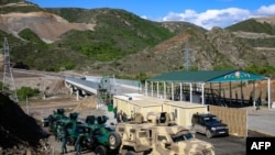 FILE - A view of an Azerbaijani checkpoint at the entry of the Lachin Corridor, the Armenian-populated breakaway Nagorno-Karabakh region's only land link with Armenia, by a bridge across the Hakari River, May 2, 2023.