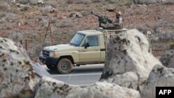 FILE - Soldiers patrol along the border with Syria to prevent trafficking, on Feb. 17, 2022, in this picture taken during a tour organized by the Jordanian Army.