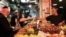 FILE - People shop for produce at a market in Jerusalem, Sept. 30, 2022. One such market recently offered the first shipment from Pakistan of food products offloaded in Israel.