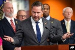 FILE - Rep. Mike Waltz, a Florida Republican, gestures during a news conference on Capitol Hill in Washington, Jan. 4, 2023.