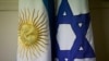 Bendera Argentina dan Israel berdiri berdampingan di kantor Guillermo Borger, presiden pusat komunitas Yahudi AMIA, selama wawancara dengan The Associated Press di Buenos Aires, Argentina, pada 8 Februari 2013. (AP/Victor R. Caivano)