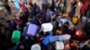 Palestinians displaced by the Israeli bombardment of the Gaza Strip queue for water at a makeshift tent camp in Khan Younis, July 1, 2024. Israel has issued an evacuation order for Palestinians in parts of the southern Gaza city.