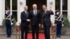 NATO Secretary General Jens Stoltenberg, left, and Dutch Prime Minister Mark Rutte, right, welcome Lithuania's President Gitanas Nauseda in The Hague, Netherlands, June 27, 2023. 