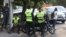 Iran's police forces stand on a street during the revival of morality police in Tehran,  July 16, 2023. Authorities sealed an office in Tehran after the company posted pictures of female employees not wearing the hijab. (Majid Asgaripour/WANA (West Asia News Agency) via Reuters)