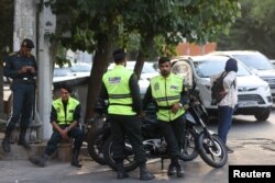 Iran's police forces stand on a street during the revival of morality police in Tehran, July 16, 2023. (Majid Asgaripour/WANA)