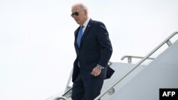 FILE - US President Joe Biden steps off Air Force One upon arrival in Minneapolis, Minnesota on April 3, 2023.