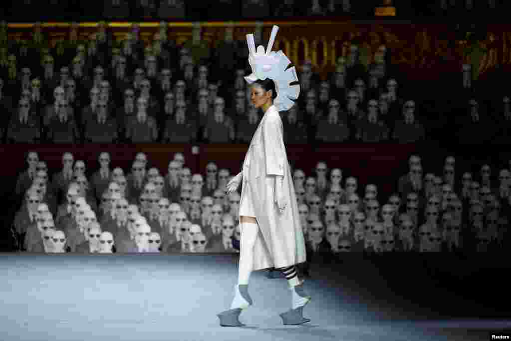 A model presents a creation by designer Thom Browne as part of his Haute Couture Fall/Winter 2023-2024 collection show at the Opera Garnier in Paris, France.