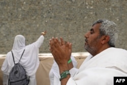 Muslim pilgrims perform the symbolic stoning of the devil ritual as part of the hajj pilgrimage in Mina, near Saudi Arabia's holy city of Mecca, June 28, 2023.