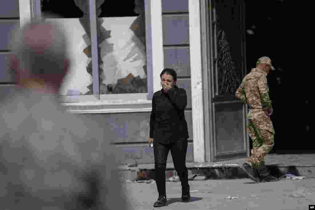 An Iraqi woman reacts at the site of a fatal fire in the district of Hamdaniya, Nineveh province, Iraq.