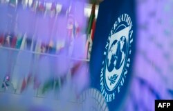 FILE - The International Monetary Fund (IMF) logo is displayed inside its headquarters in Washington, on Oct. 10, 2017. The International Monetary Fund (IMF) said on July 12, 2023, that it has approved a $3 billion loan agreement for Pakistan