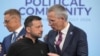 FILE - Ukrainian President Volodymyr Zelenskyy speaks to NATO Secretary-General Jens Stoltenberg before the first plenary session at the European Political Community meeting at Blenheim Palace in Woodstock, Britain, July 18, 2024.