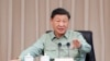 资料照片：2023年4月11日，中国领导人习近平在广东湛江视察南部战区海军司令部时讲话。（美联社照片）
