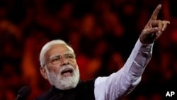 FILE - Indian Prime Minister Narendra Modi speaks at Qudos Bank Arena in Sydney, May 23, 2023. More than two dozen opposition parties have forged an alliance, called INDIA, to challenge Modi in 2024.