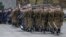 FILE - Soldiers are seen marching in a parade during a ceremony to mark the 25th anniversary of Poland joining NATO, on March 12, 2024 in Warsaw. 